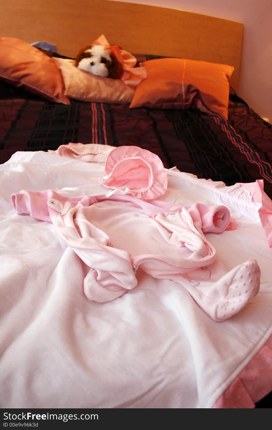 Children's clothes on a bed before a sleeping. Children's clothes on a bed before a sleeping