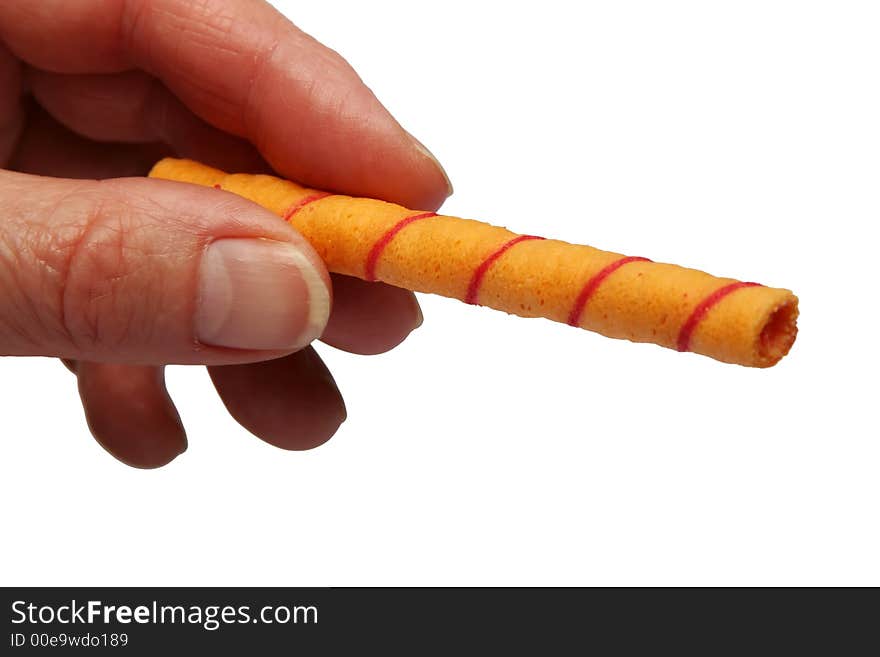 Digital photo of a hand with a candy.