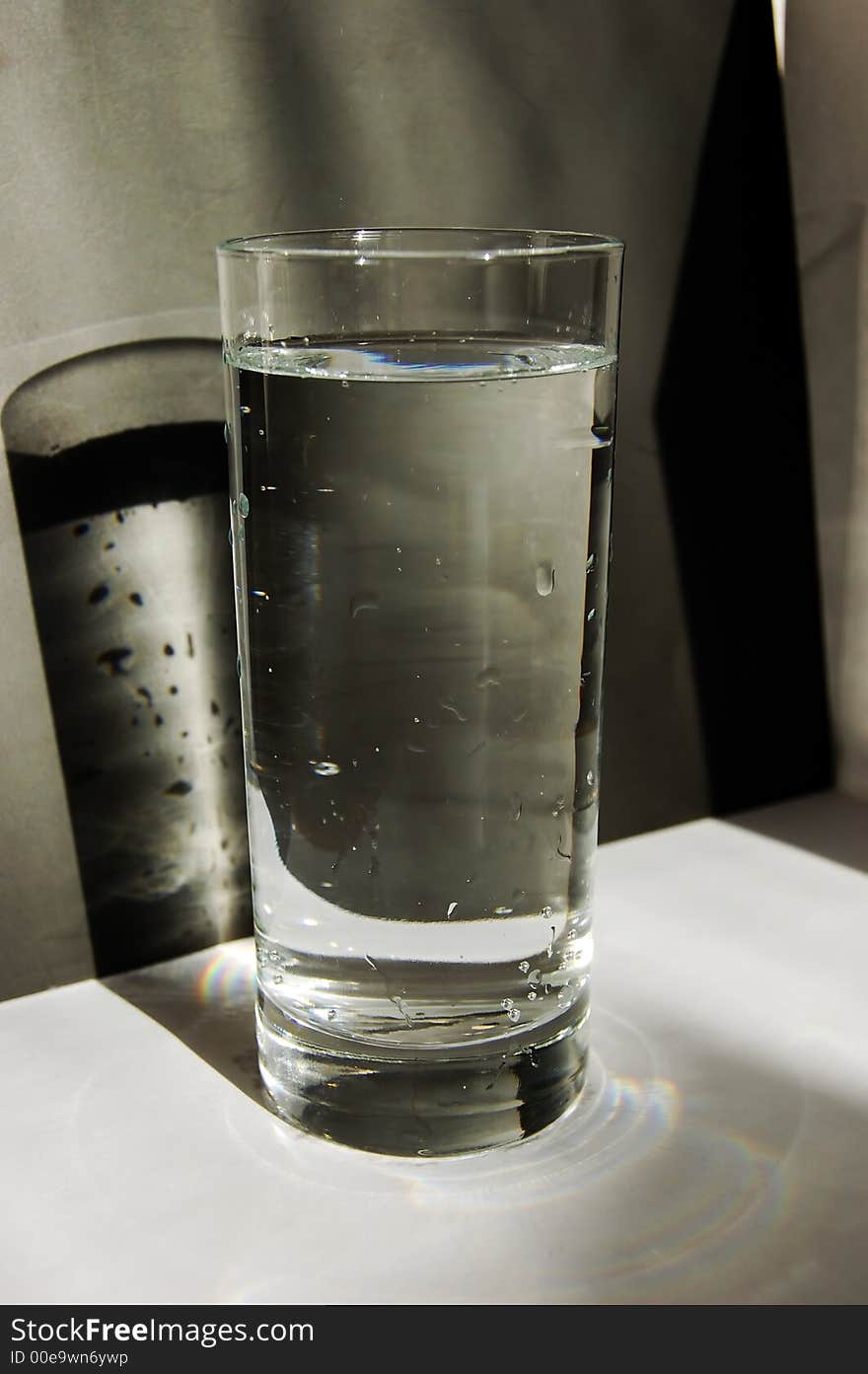 Glass of water on a black and white background. Glass of water on a black and white background