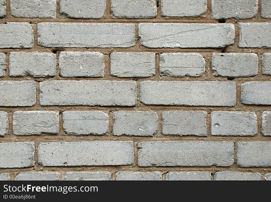 Wall of white bricks. Close-up view. Cement.