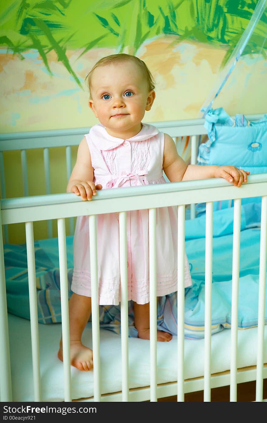 Portrait od little girl in crib. Portrait od little girl in crib