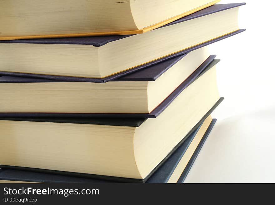 Stack of books against a white background