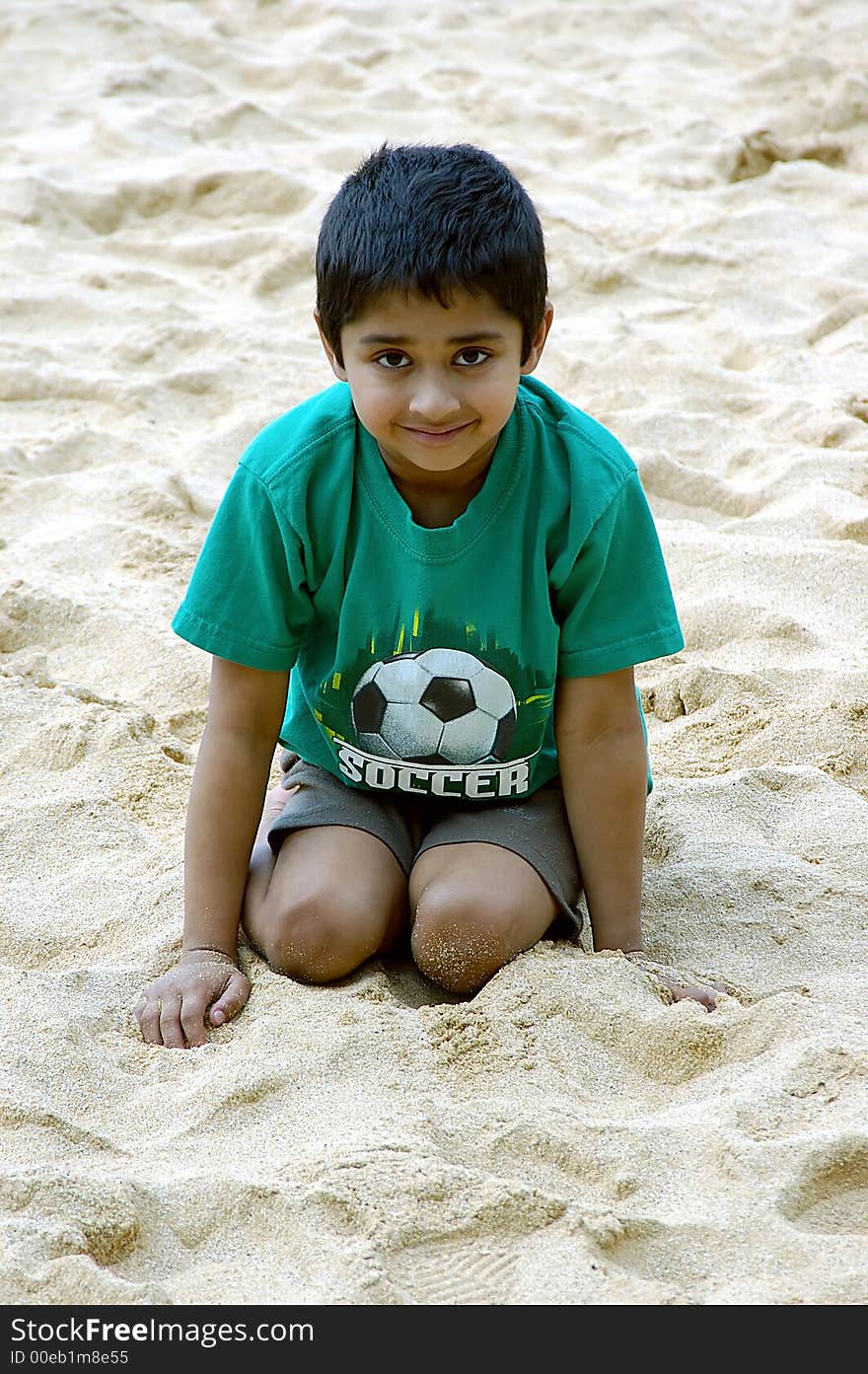 An handsome boy relaxing on a beach