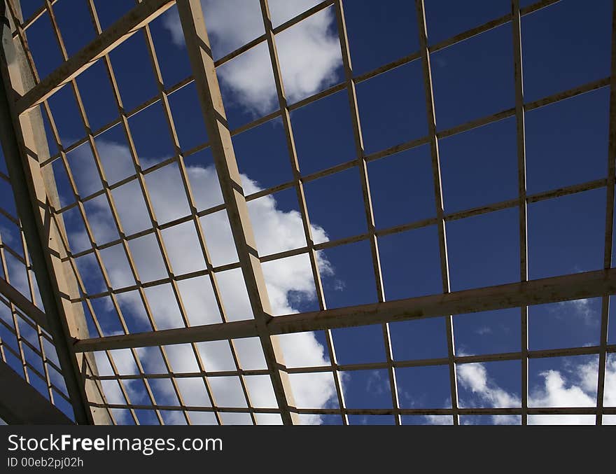 Clouds after the rain as seen through restrictive bars. Clouds after the rain as seen through restrictive bars.