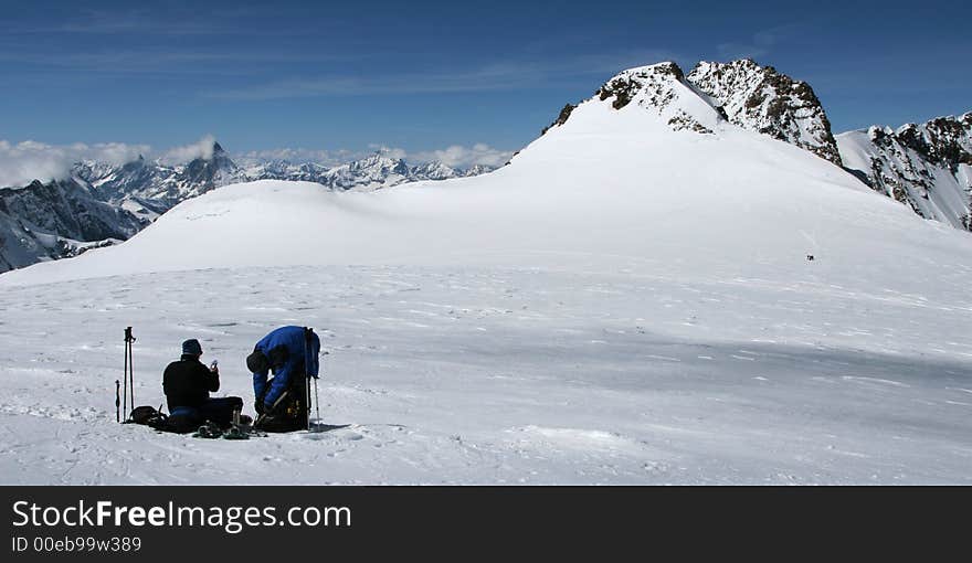 Climbers resting on a mountain plateau. Climbers resting on a mountain plateau