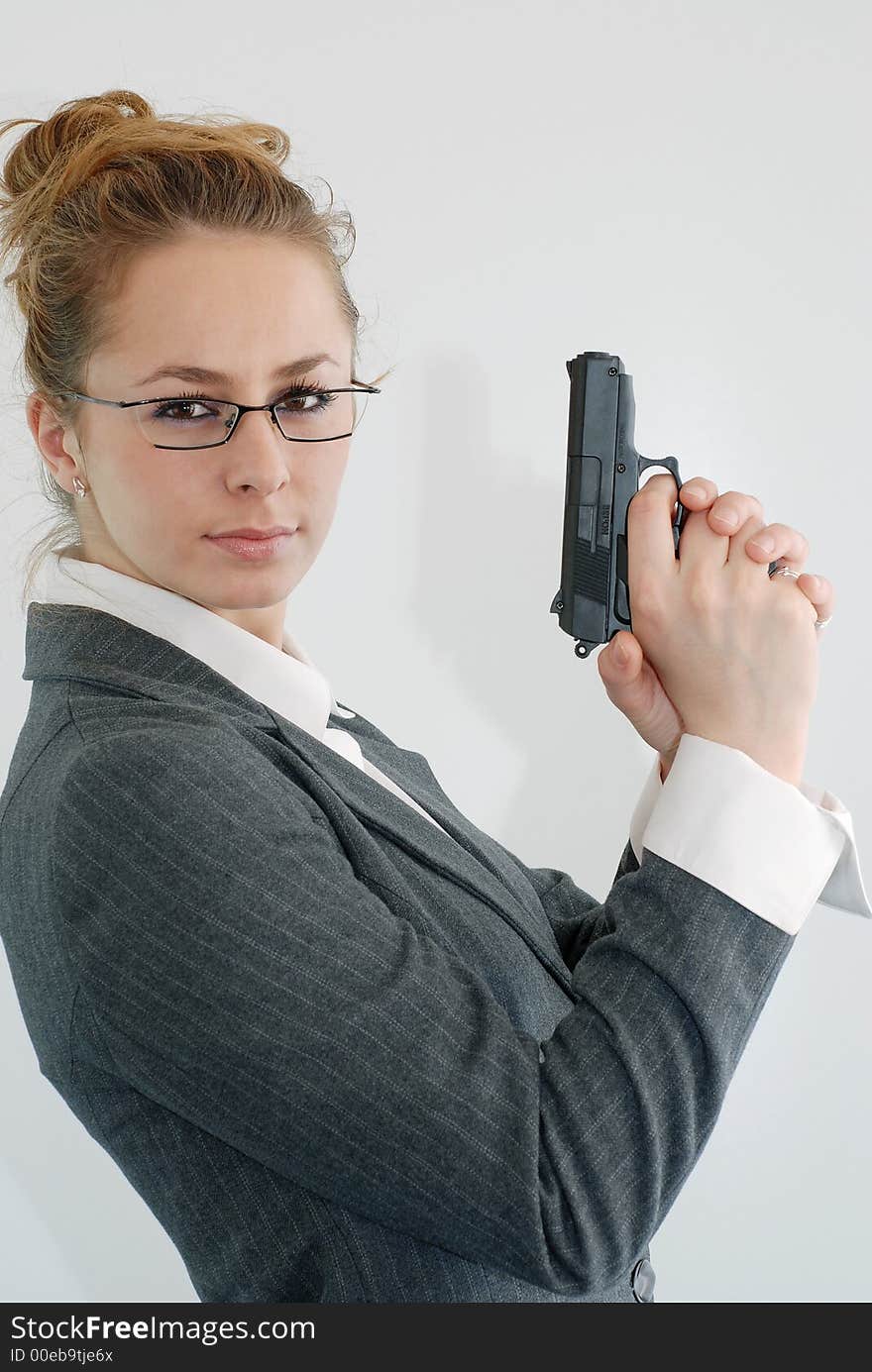 Woman in office with toy gun. Woman in office with toy gun