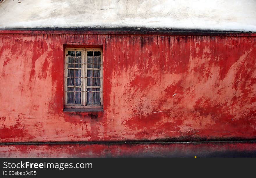 Window on old red house. Window on old red house