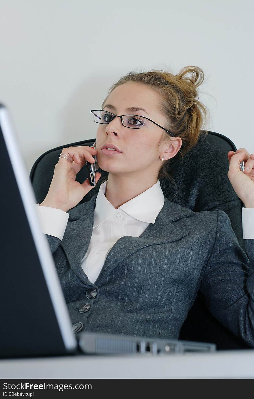 Young business woman in office. Young business woman in office