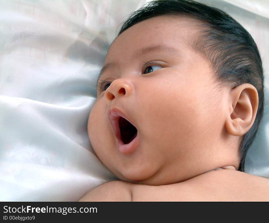 Two month old baby yawning. Two month old baby yawning.