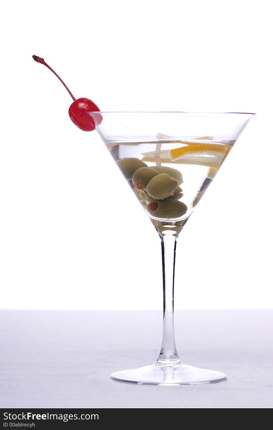 Colorful alcoholic cocktail in a glass against white background. Colorful alcoholic cocktail in a glass against white background