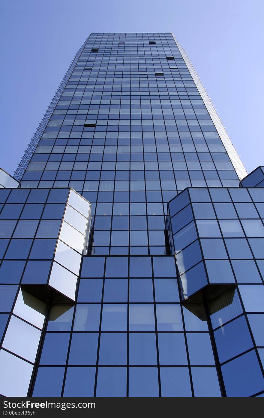 Blue skyscraper shot at a vertical angle perspective. Blue skyscraper shot at a vertical angle perspective