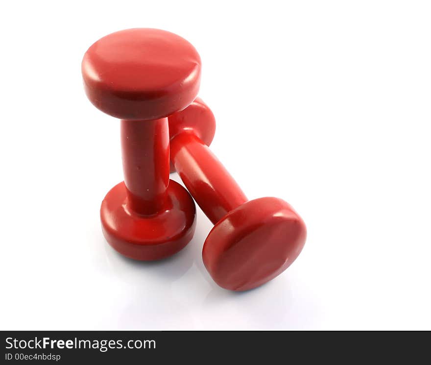 A set of weight training Dumbbells on a white background. A set of weight training Dumbbells on a white background