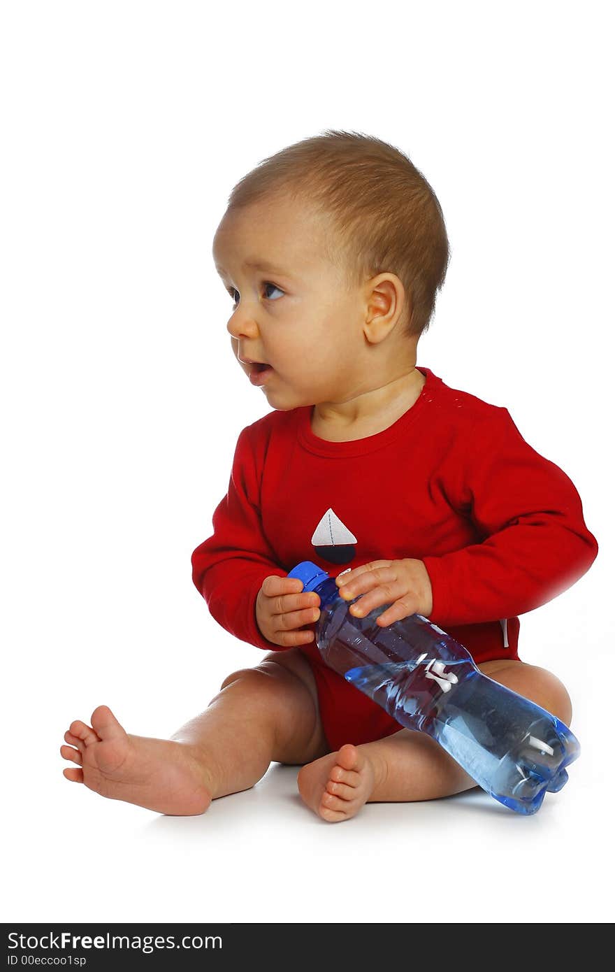 Sitting baby with bottle of clean water