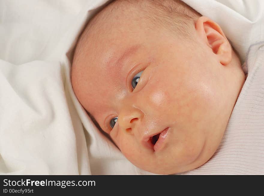 Newborn child on white background. Newborn child on white background