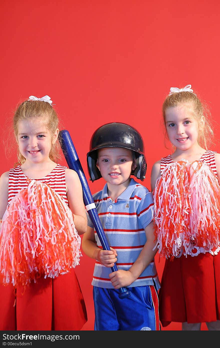 Shot of a baseball boy & cheerleaders vertical