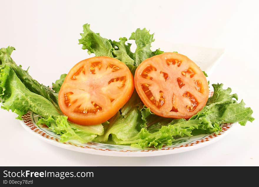 Photo of vegetables tomatoe and green lettuce. Photo of vegetables tomatoe and green lettuce