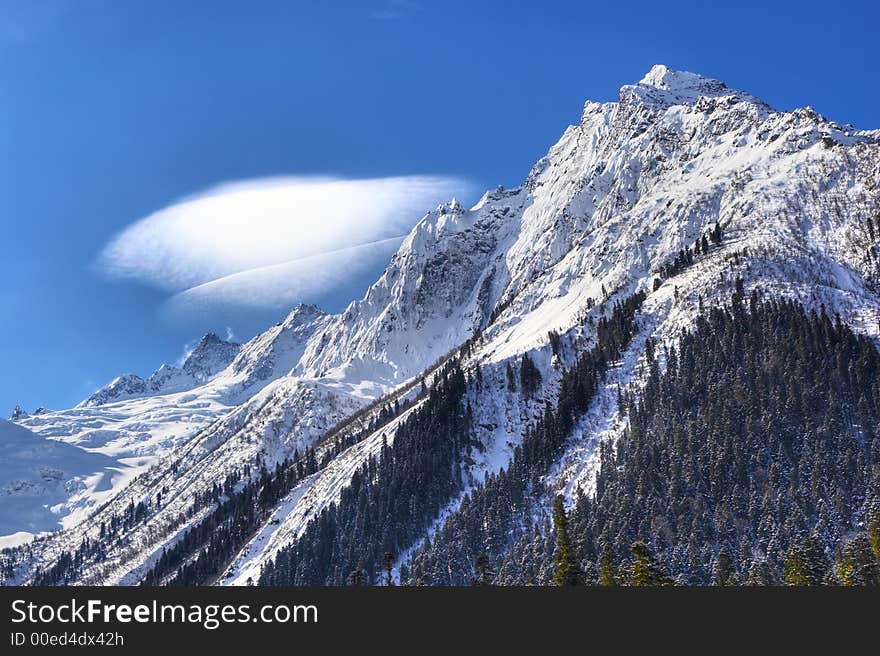 Strange cloud above the rock. Strange cloud above the rock