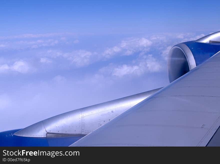 A plane wing during a high altitude flight.