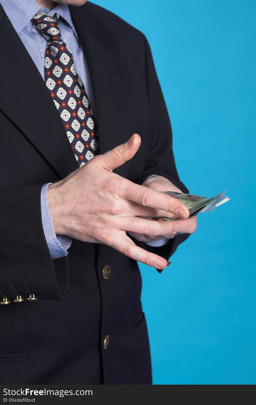 Businessman and money over blue background