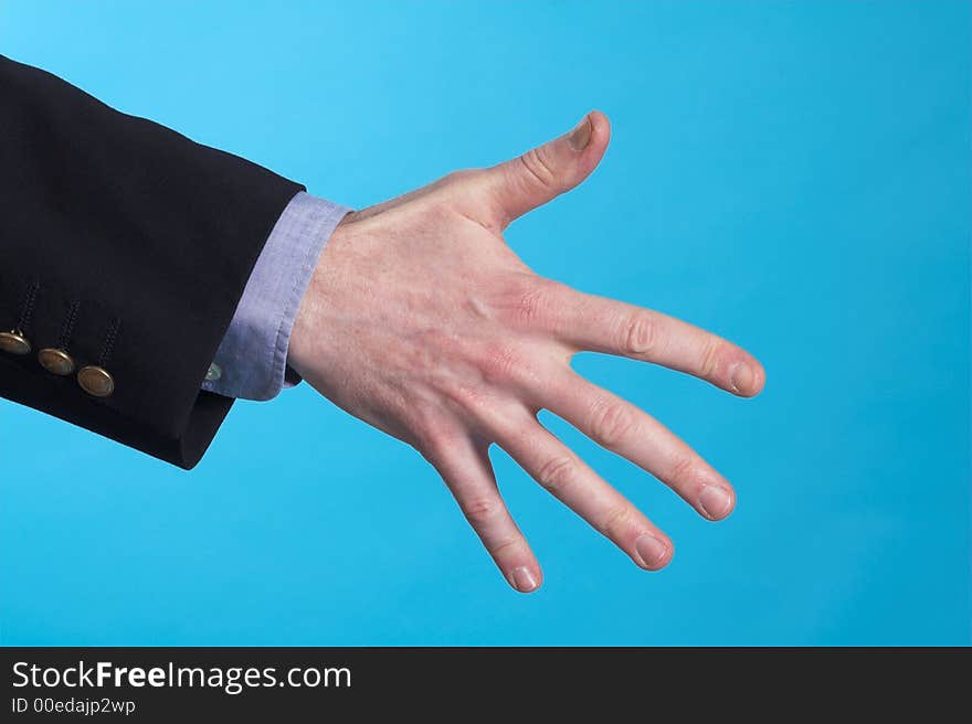 Businessman doing hand sign over blue background