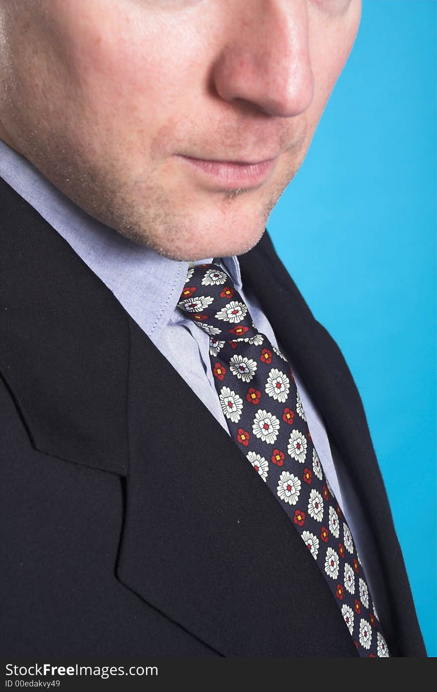 Man in business suit standing over blue background. Man in business suit standing over blue background