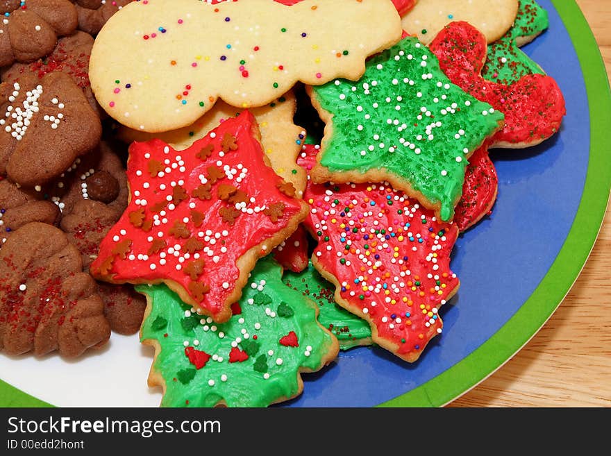 Red, green, and white Christmas cookies with sprinkles in a pile. Red, green, and white Christmas cookies with sprinkles in a pile.