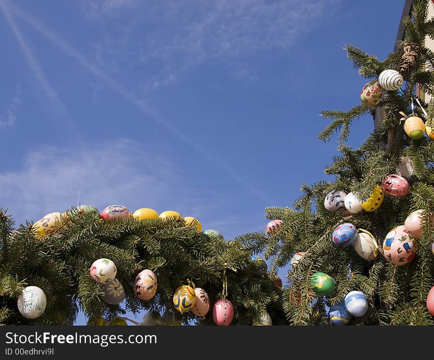 Branches wrapped round an easter fountain with easter eggs