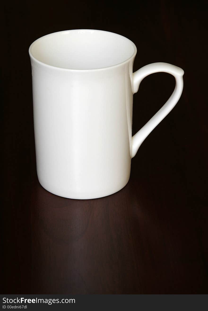 White Empty Coffee Cup On A Dark Wooden Table, Reflection. White Empty Coffee Cup On A Dark Wooden Table, Reflection