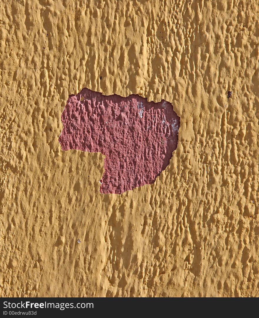 Grunge wall with peeling red and yellow paint. Grunge wall with peeling red and yellow paint