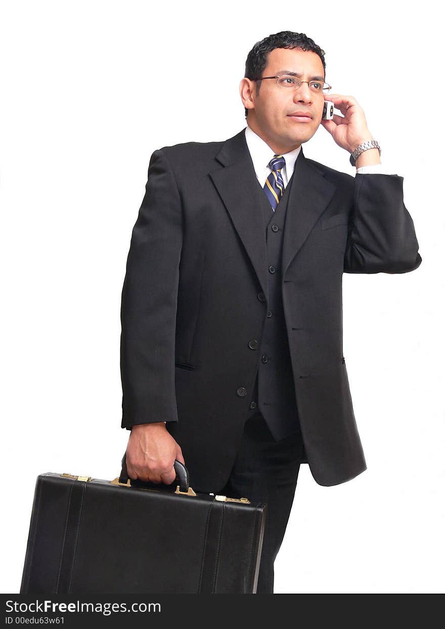 An businessman on the run is talking on his cell phone and carrying					
a briefcase.