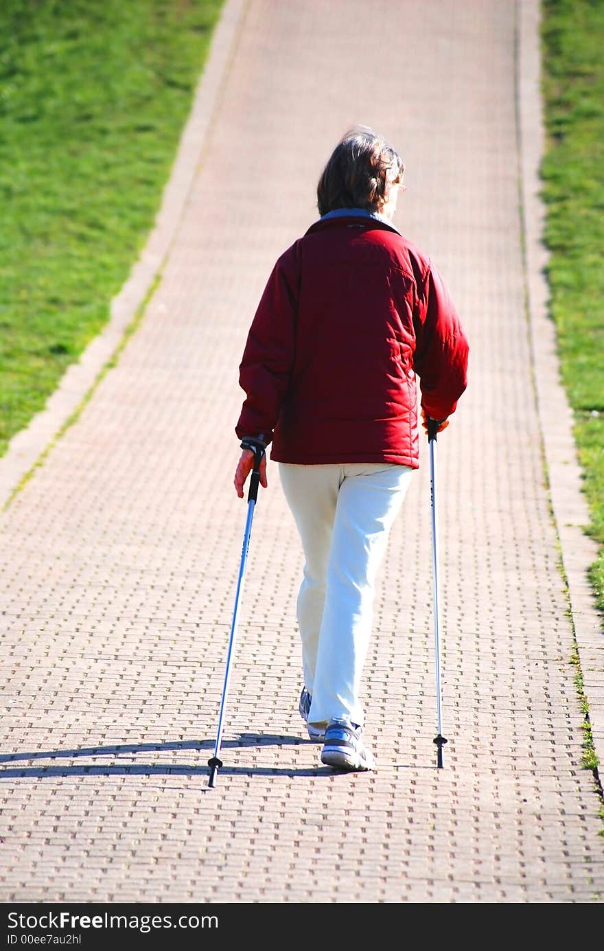 Old woman is tumbling along a way