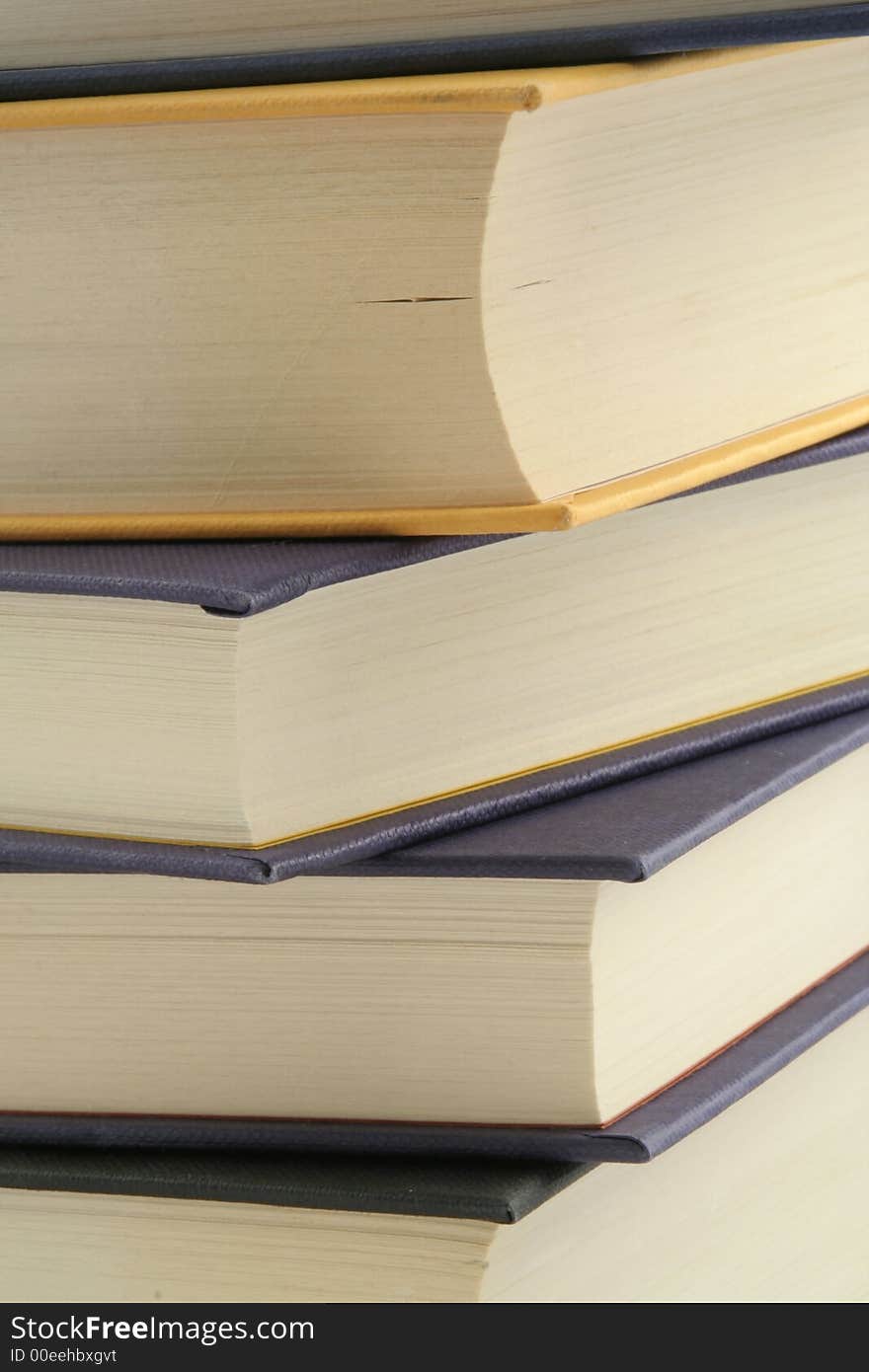 Stack of books against a white background