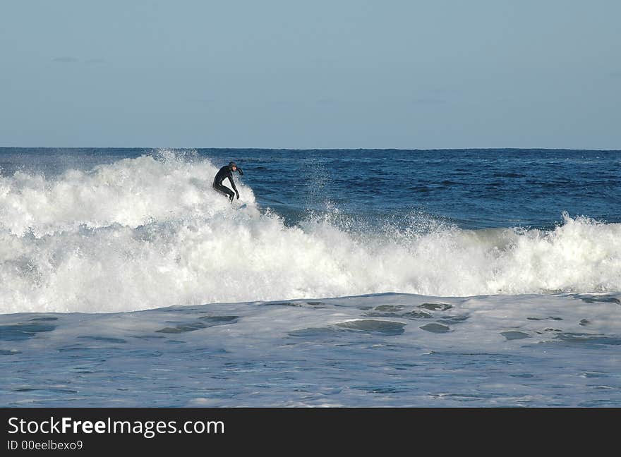 Surfer riding the waves on the Atlantic coast