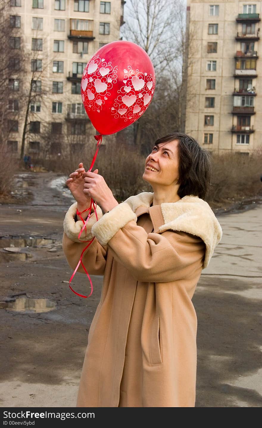 The woman with a red air-balloon. The woman with a red air-balloon