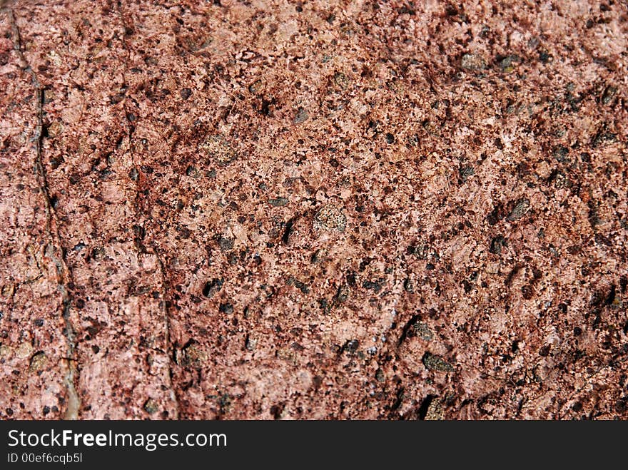 Red stone surface in close-up. Red stone surface in close-up