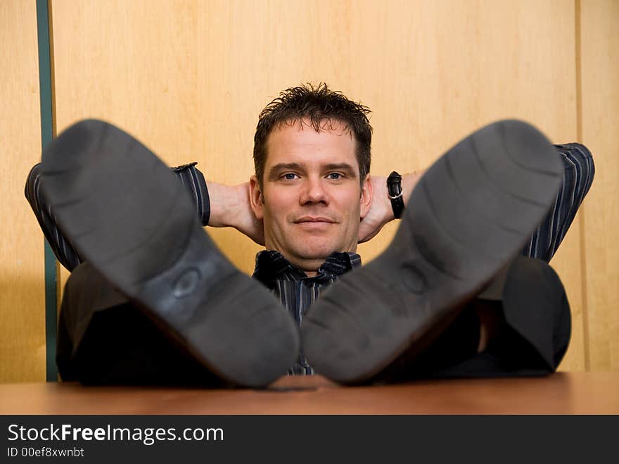 Business man with his feet on the desk. Business man with his feet on the desk