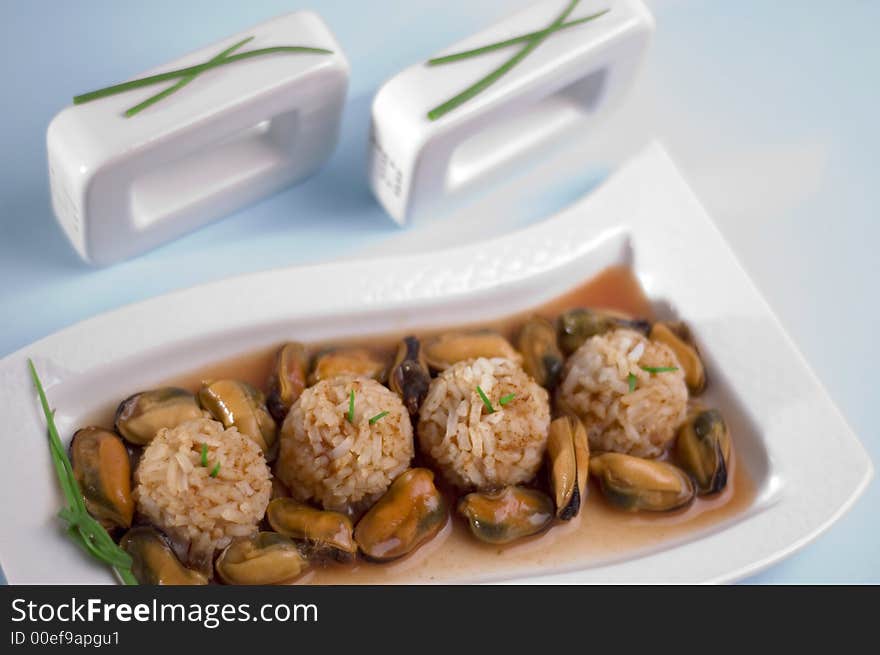 Shells with rice on the blue background