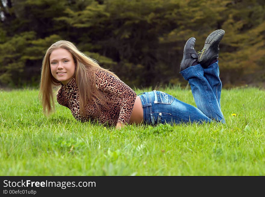 Cheerful Girl On The Grass