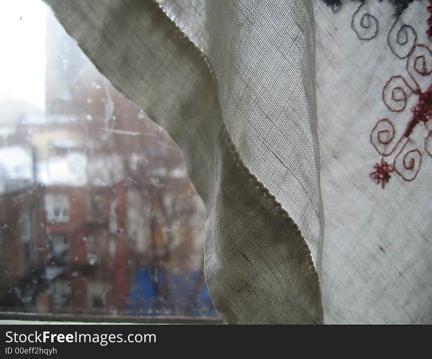 Window, curtains on rainy day