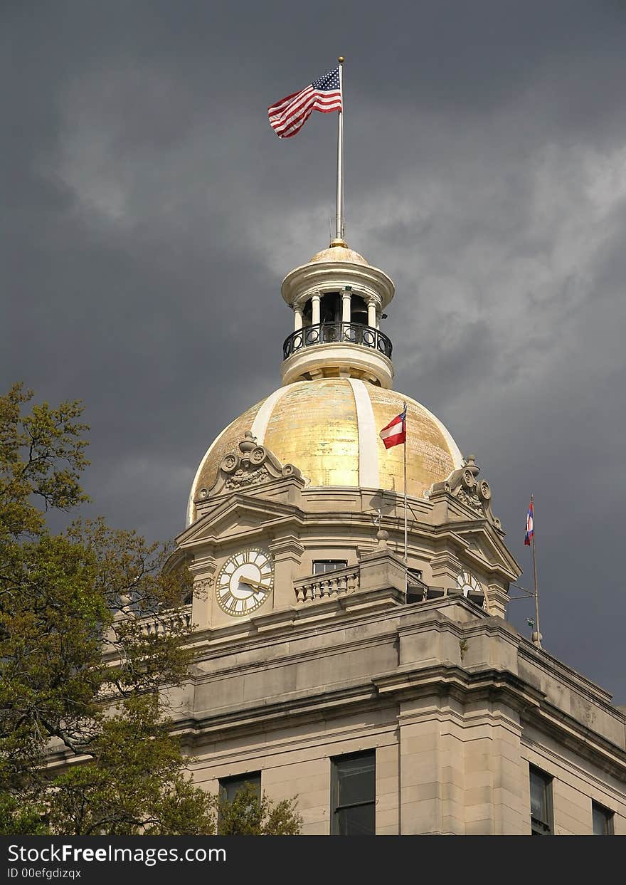 Gold Domed City Hall with waving flag during storm. Gold Domed City Hall with waving flag during storm