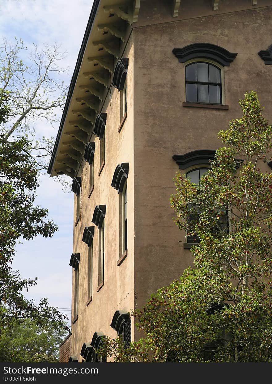 Historic Building side view with trees and windows. Historic Building side view with trees and windows