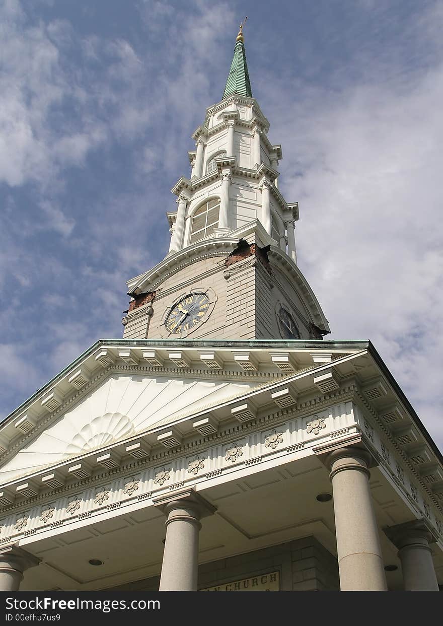 Historic Church steeple with cross against blue sky. Historic Church steeple with cross against blue sky