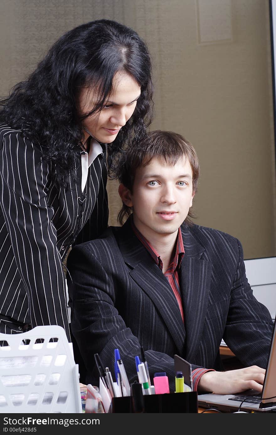 Group of 2 business people working together in the office. Group of 2 business people working together in the office.