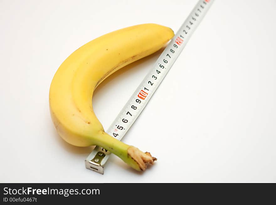 Banana and its size with a measuring roulette