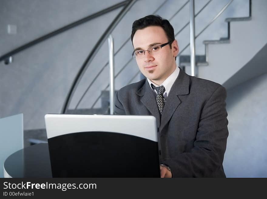 Successful businessman working on laptop