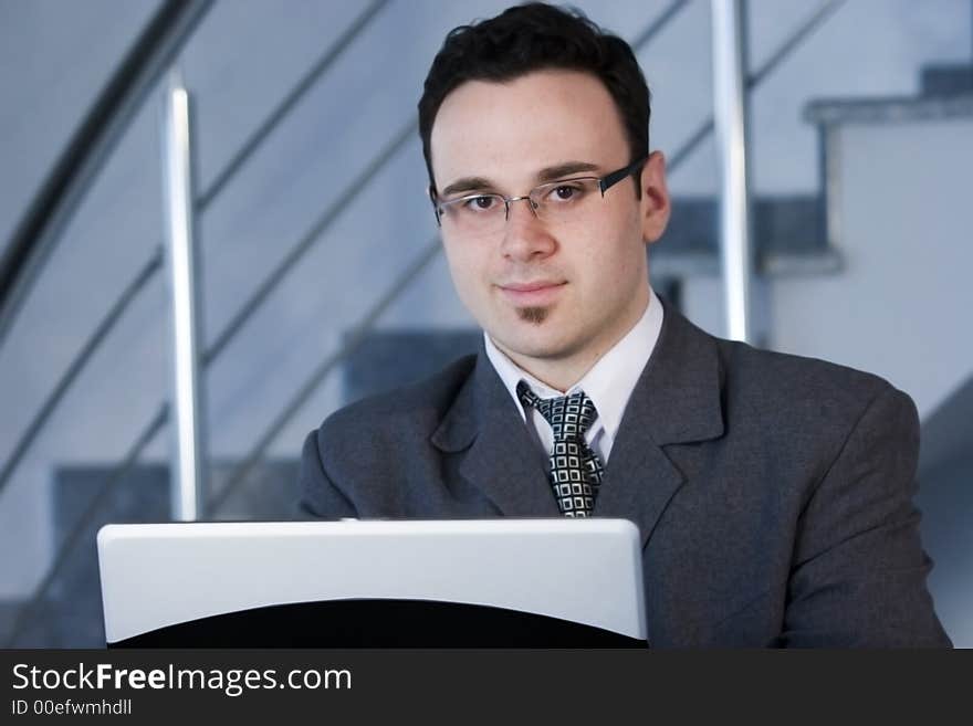 Successful businessman working on laptop