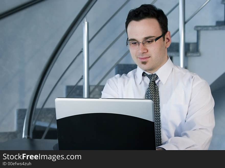 Successful businessman working on laptop