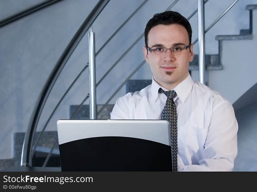 Successful businessman working on laptop