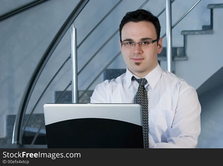 Successful businessman working on laptop