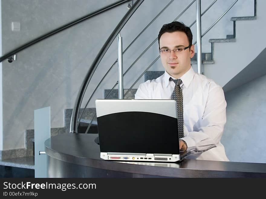 Successful businessman working on laptop